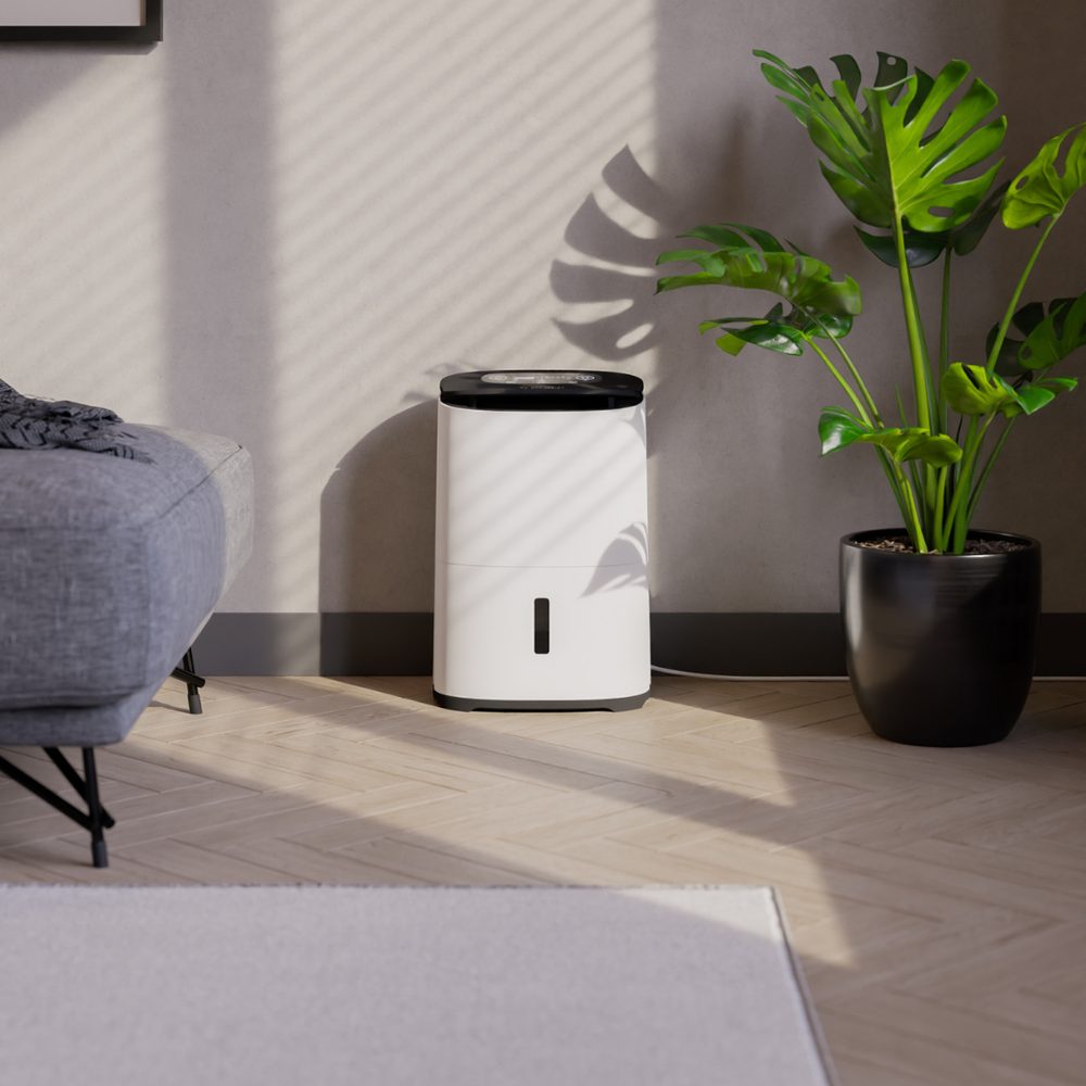 Meaco Arete Two 12L σε σαλόνι — Compact αφυγραντήρας δίπλα σε καναπέ